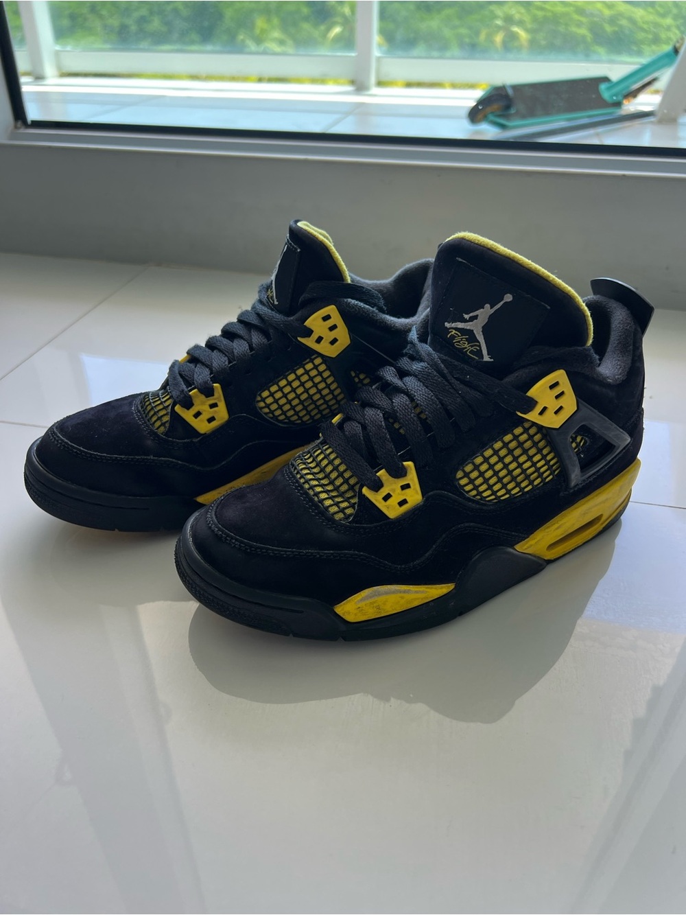 Jordan Black and Yellow Air Jordan 4 Sneakers